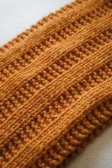 Yellow-orange cowl on cream background thumbnail