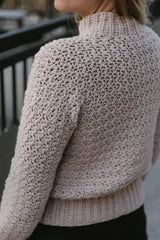 Back of tan sweater, it is plain. thumbnail