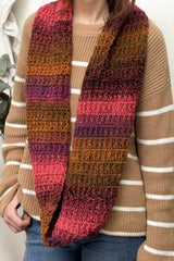Front view of infinity scarf/log cowl crocheted in shades of pink and orange. thumbnail