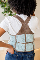 Back view of vest showing racerback style, with straps meeting between the shoulders and connecting to a triangular panel. thumbnail