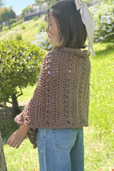 Side back view of crochet poncho. thumbnail