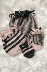 Four knit bags scattered on white background thumbnail