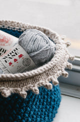 Close up of cream edging on teal basket thumbnail