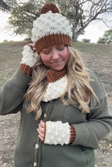 Woman wears brown & cream crochet set of hat, cowl, and mitts. thumbnail