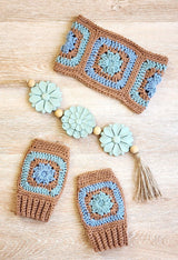 Crochet headband and mitts in tan and aqua, on wooden table thumbnail