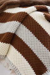 Textured crochet blanket in cream, linen, and warm brown.  thumbnail