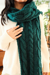 Close up of tealy-green cabled scarf, showing cables of various sizes.  thumbnail