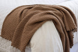 Full view of warm brown blanket draped over foot of bed.  thumbnail