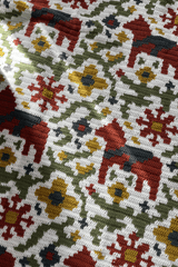 Close up of all over tapestry style motif of horses, flowers, and vines on white background.  thumbnail