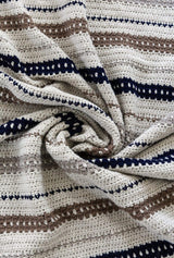 Close up view of crochet blanket, twisted in the center.  thumbnail