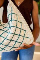 Close up of bottom corner of bag, showing side gusset panel and diamond overlay detail.  thumbnail