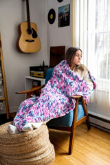 girl wrapped in knit blanket thumbnail