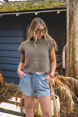 woman wearing a crochet top thumbnail