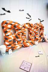 BOO crochet letters surrounded by other Halloween decor thumbnail