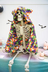 Crochet Halloween hooded blanket on a skeleton decoration thumbnail