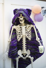 Knit Halloween theme blanket on a skeleton decoration thumbnail