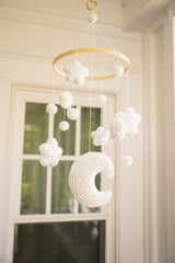 Crochet mobile hanging in front of a window thumbnail