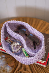 purple caddy with two compartments on a side table thumbnail