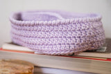 close up of purple caddy with two compartments on a side table thumbnail