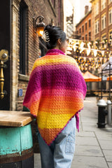 Woman wearing colorful shawl showing back point thumbnail